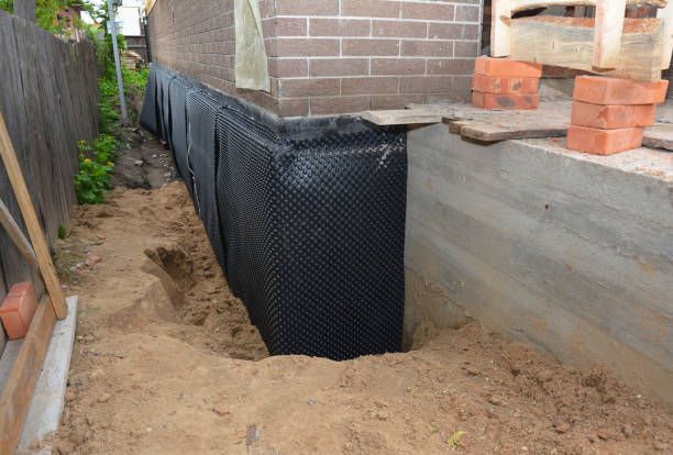 SJ Waterproofing Pros technician performing targeted Emergency Waterproofing assessment in Warminster, PA